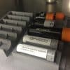 Storage tubes that have been laser-etched by AFYS3G's information marking systems